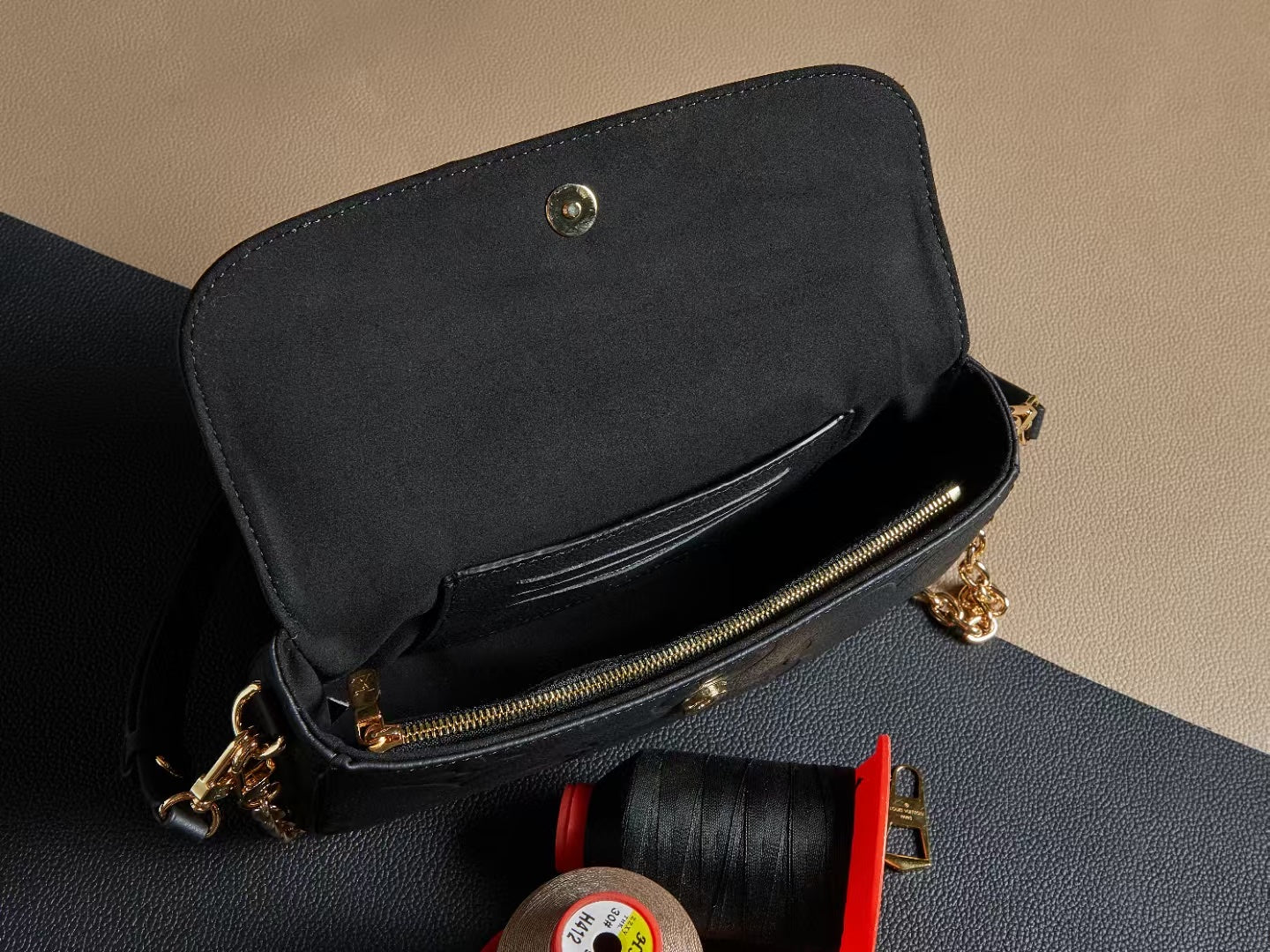 Louis Vuitton leather mini bag with open flap, gold zipper and chain hardware, black