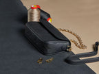 Louis Vuitton monogram crossbody bag, black textured leather, gold hardware, chain strap