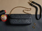 Louis Vuitton monogram flap shoulder bag with gold chain strap, black textured leather
