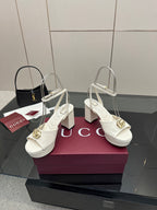 Gucci women's white heeled platform sandals with gold logo buckle and block heel