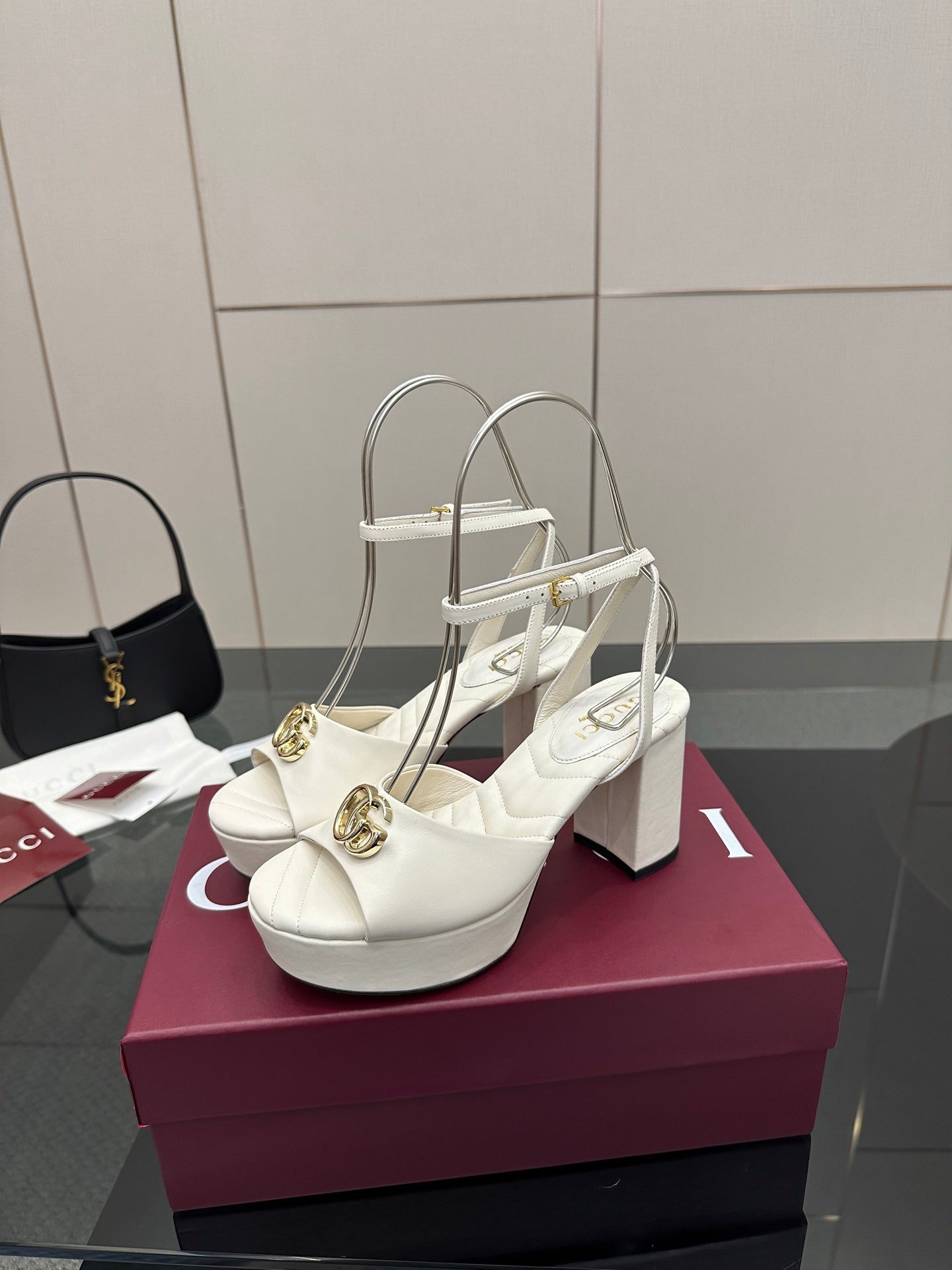 Gucci women's white platform heeled sandals with gold logo hardware and sling straps