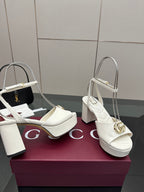 Gucci women's white platform heeled sandals with quilted straps and gold logo buckle