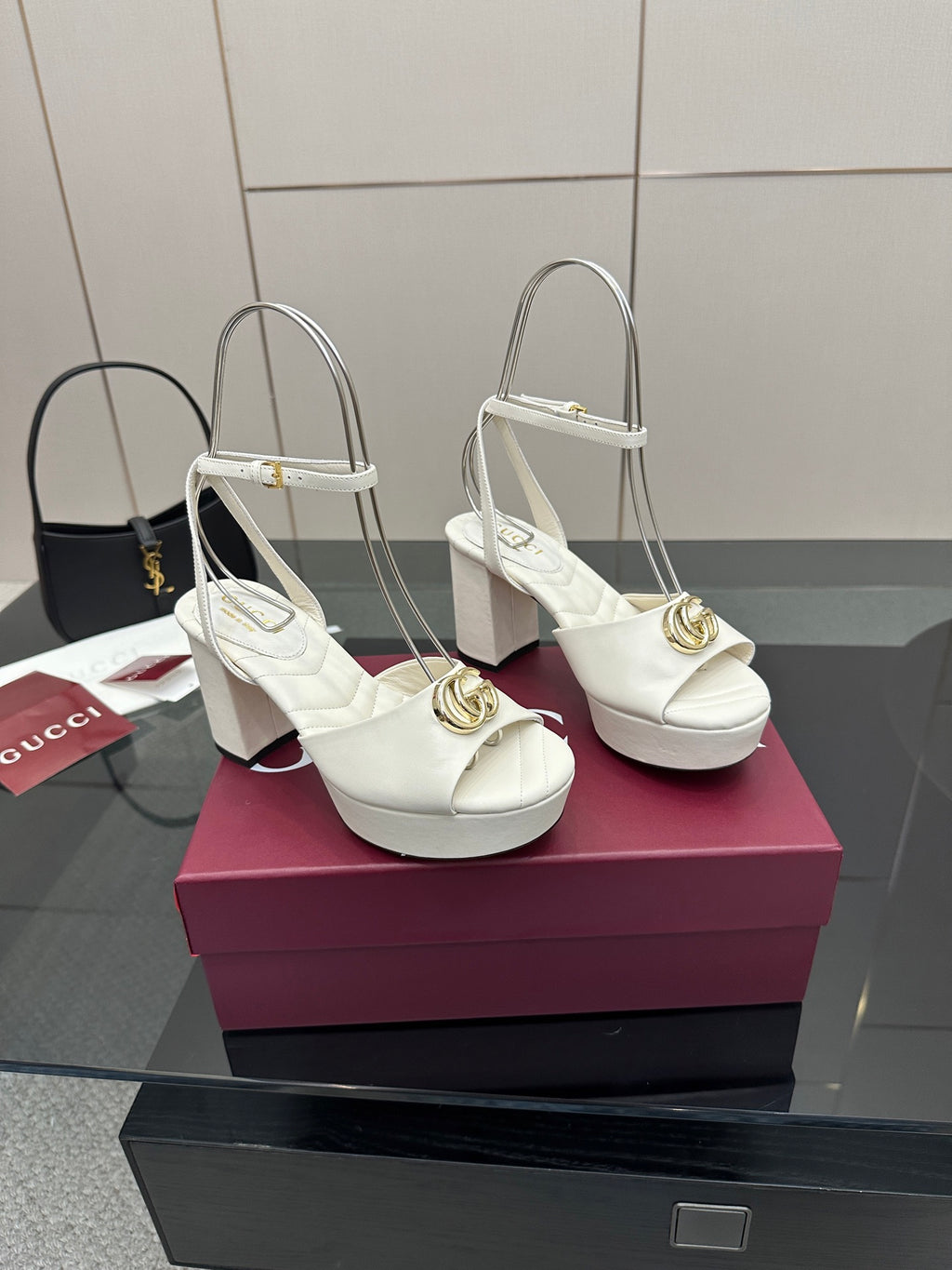 Gucci women's white platform heeled sandals with square toe, gold clasp, and ankle strap