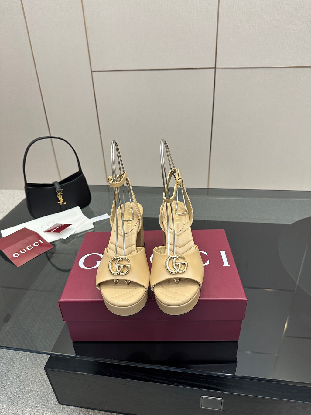 Women's cream Gucci logo platform sandals with gold-tone buckle, slingback straps