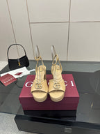 Women's cream Gucci logo platform sandals with gold-tone buckle, slingback straps