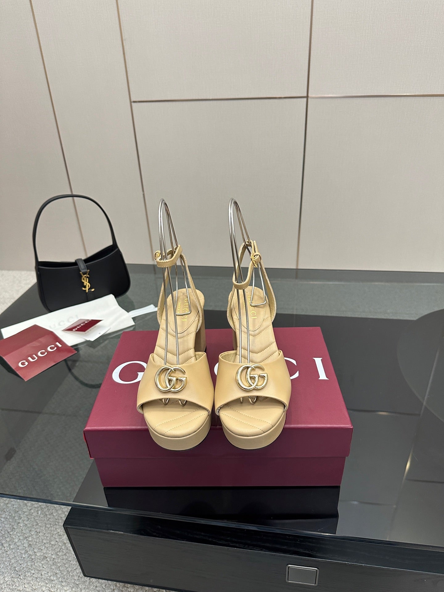 Women's cream Gucci logo platform sandals with gold-tone buckle, slingback straps