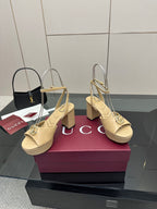Women's cream heeled sandals with slingback straps and gold-tone Gucci emblem detail