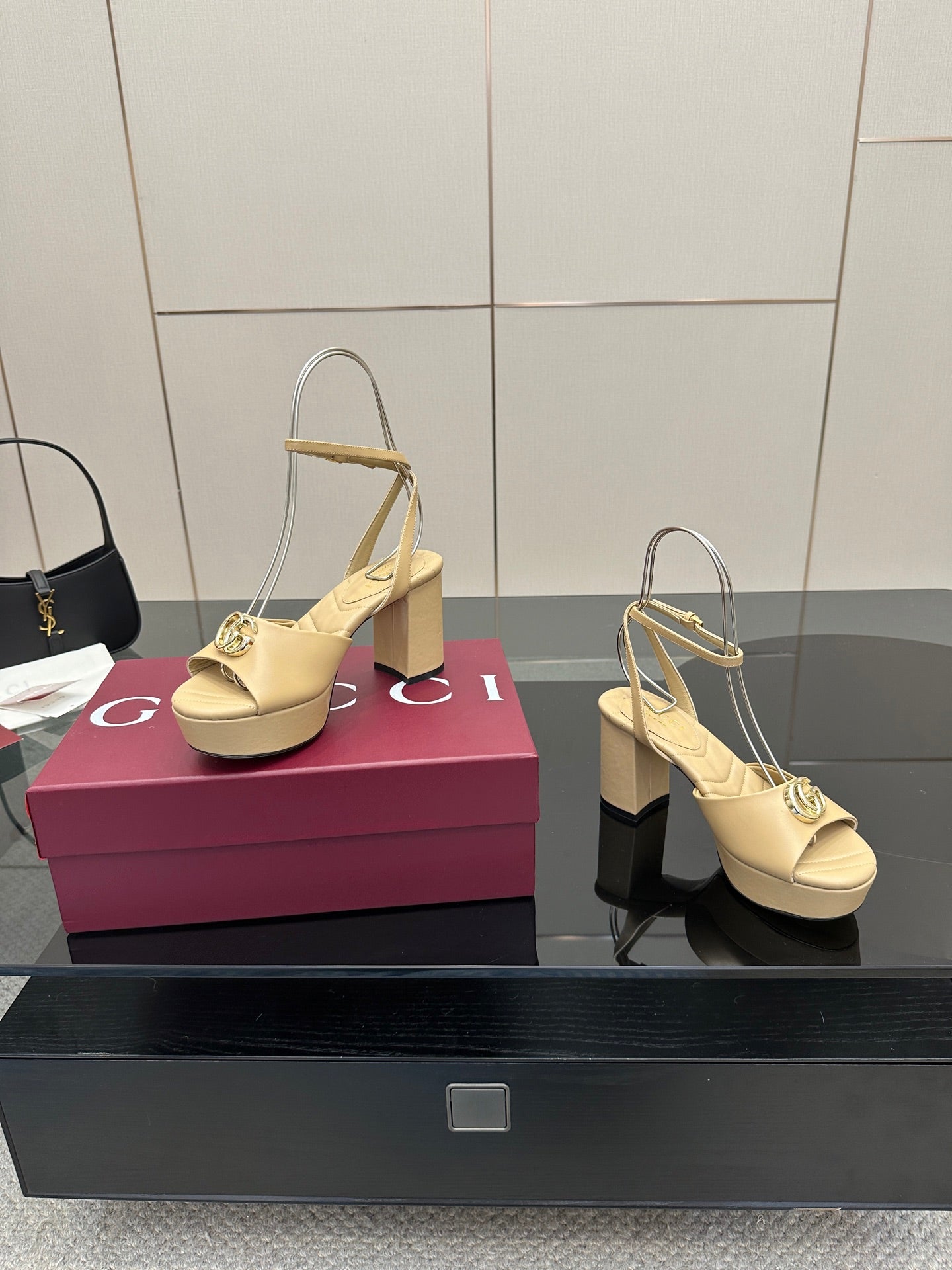 Women's cream slingback sandals with gold-tone Gucci emblem buckle and block heel