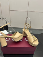 Women's cream platform sandals with gold-tone Gucci emblem buckle and block heel