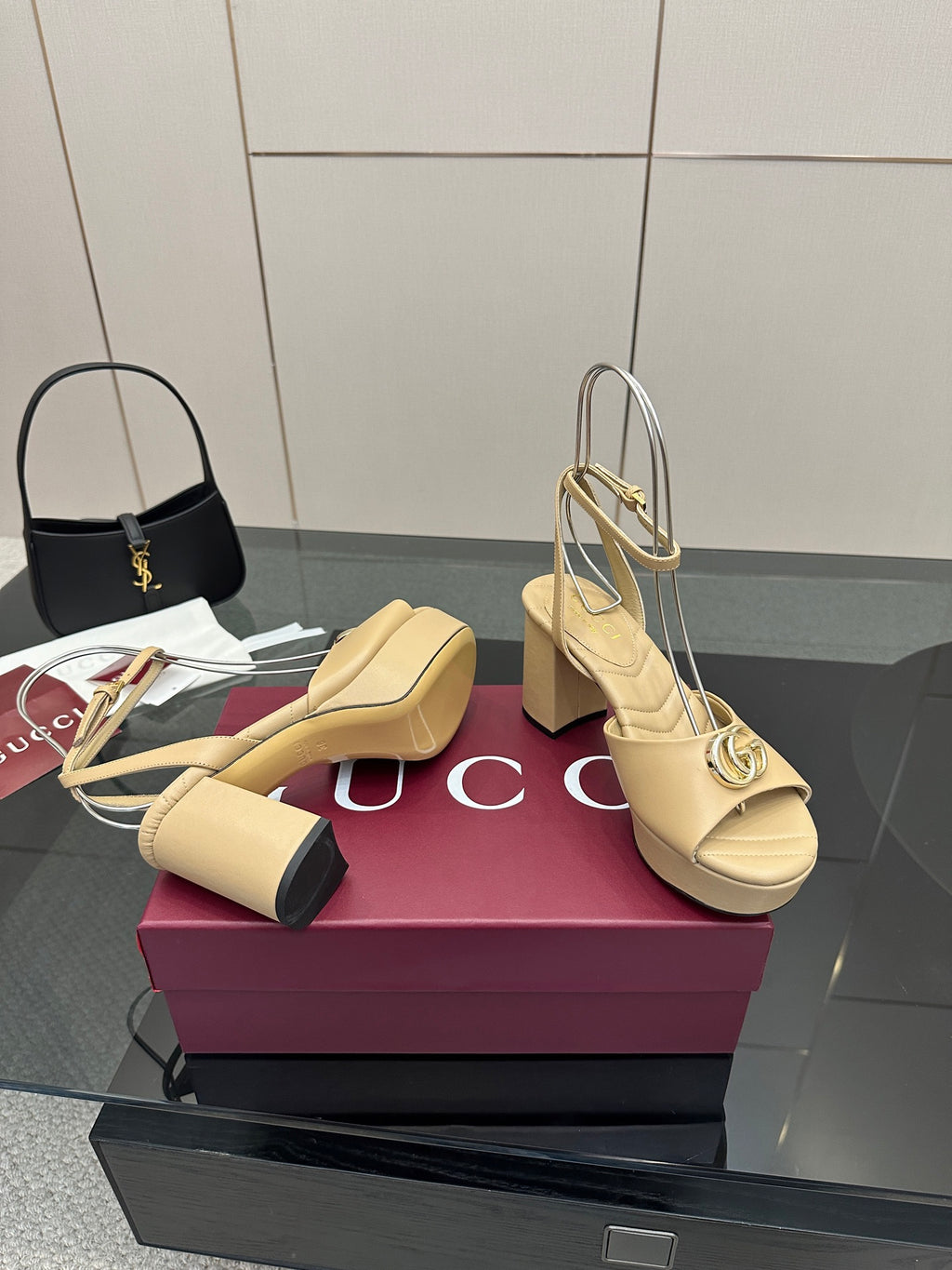 Women's cream platform sandals with gold-tone Gucci logo buckle and open toe