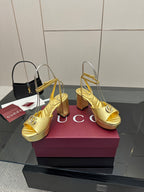 Gucci metallic gold peep-toe heeled sandals with ankle straps and thick platform