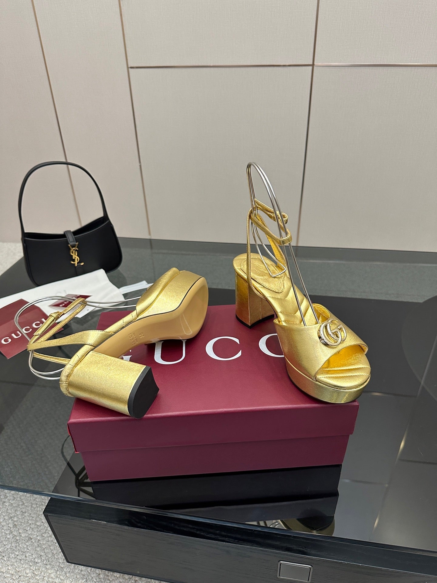 Gucci metallic gold heeled sandals with logo detail, peep toe, and block heel