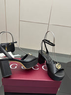 Gucci black platform heeled sandals with gold logo buckle and wide block heel