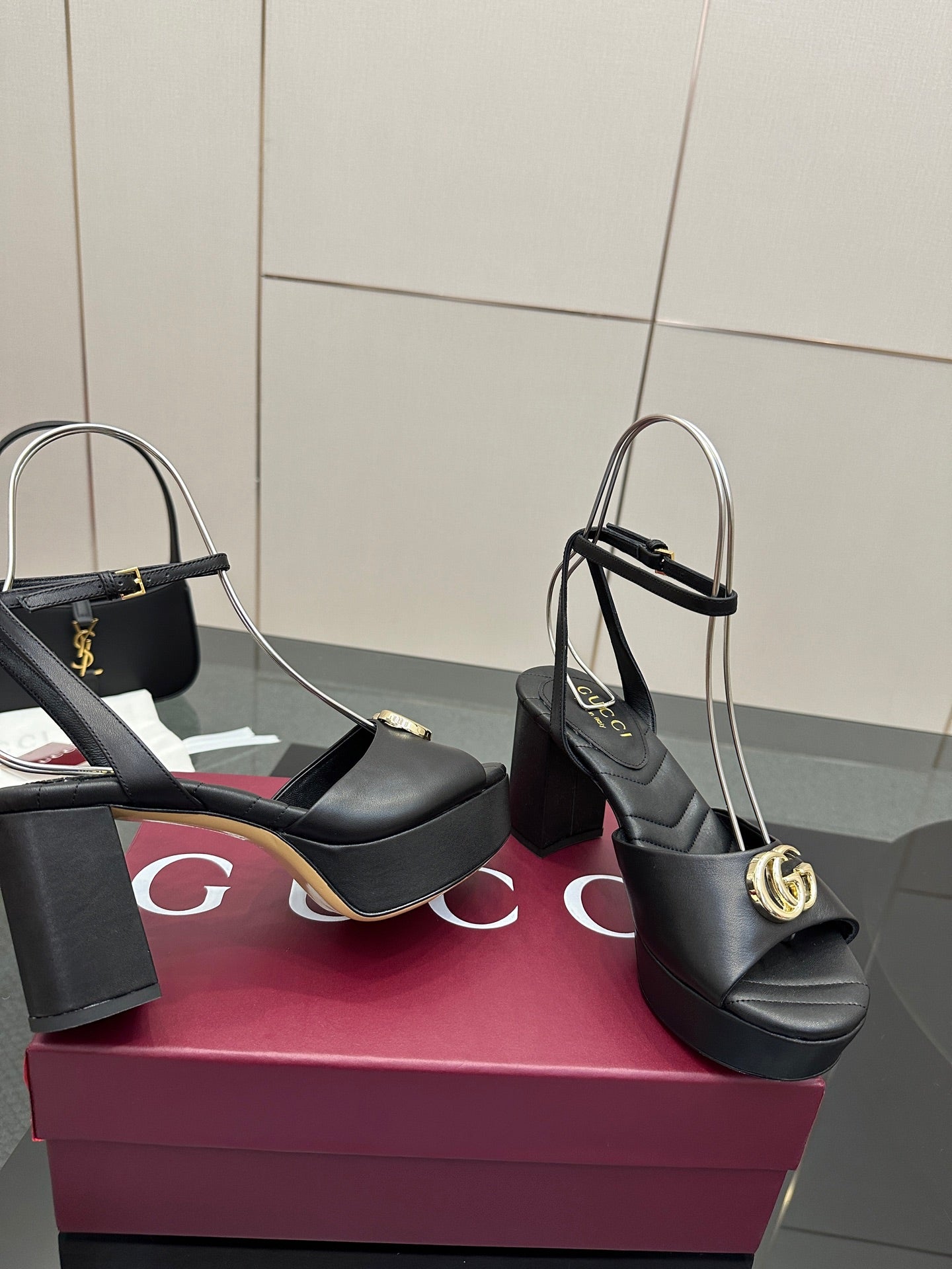 Gucci black platform heeled sandals with gold logo buckle and wide block heel
