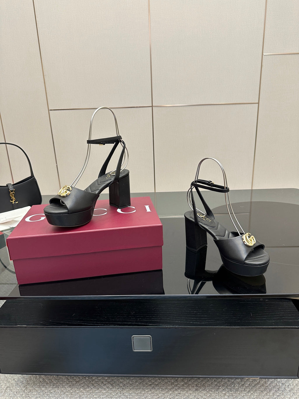 Gucci black platform heeled sandals with gold logo buckle and open toe slingback