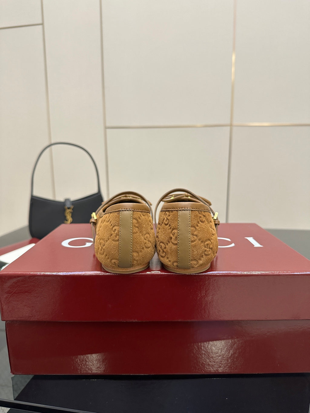 Gucci ladies loafers in tan patterned fabric with gold-tone hardware, back view