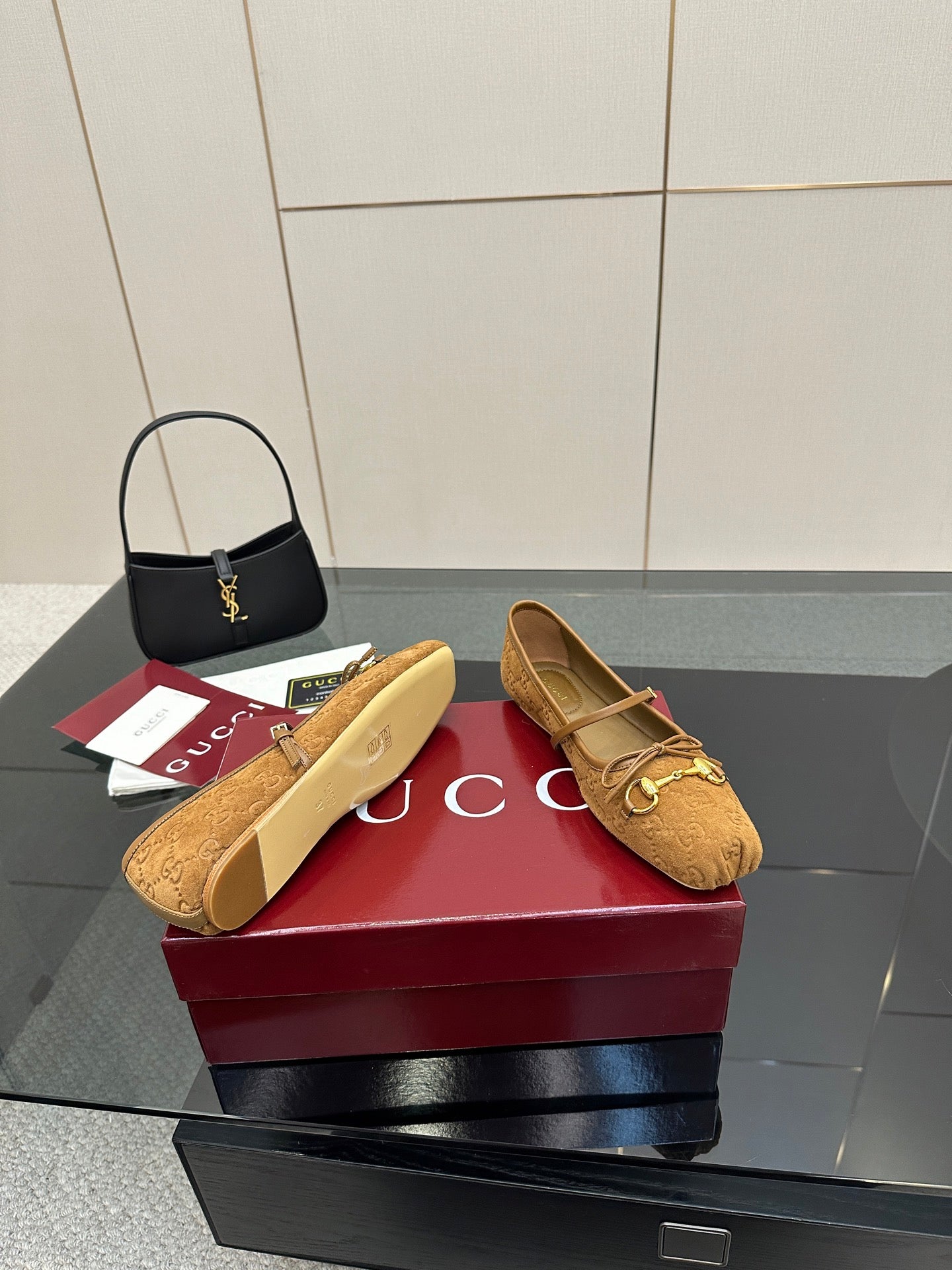 Gucci ladies loafers in tan patterned fabric with gold-tone horsebit hardware, sole shown