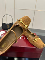 Gucci ladies loafer in tan patterned fabric with gold-tone horsebit hardware, side view
