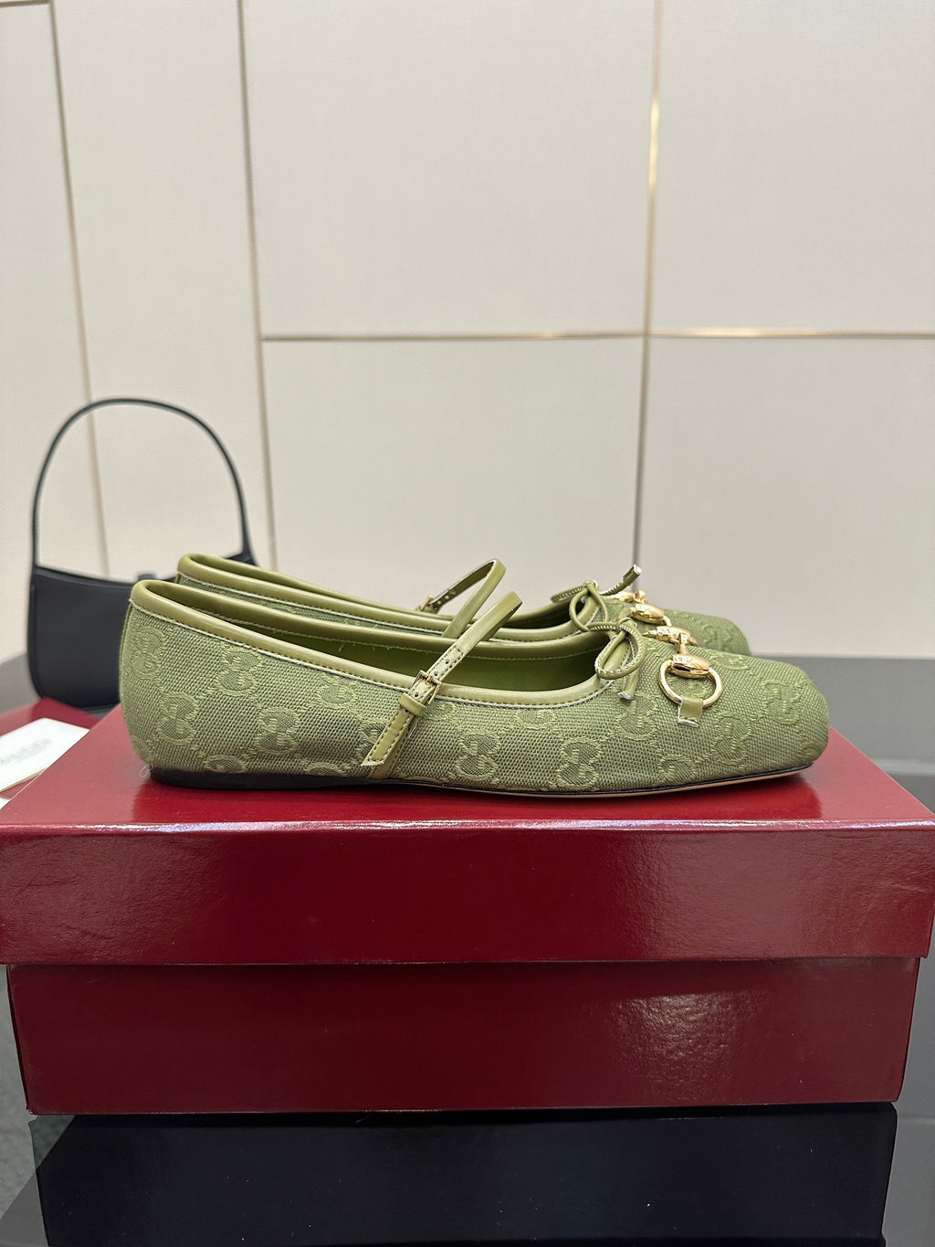Green patterned Gucci loafer, top view with knotted bow ties and horsebit detail
