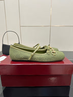 Green patterned Gucci loafer, top view with knotted bow ties and horsebit detail