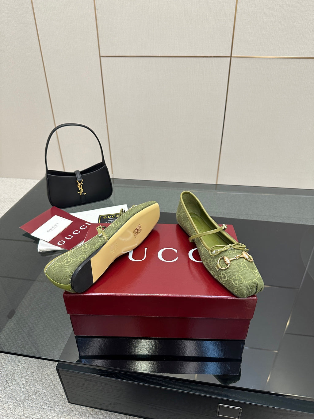 Green patterned Gucci loafers, side-by-side view with gold horsebit and slip-on silhouette