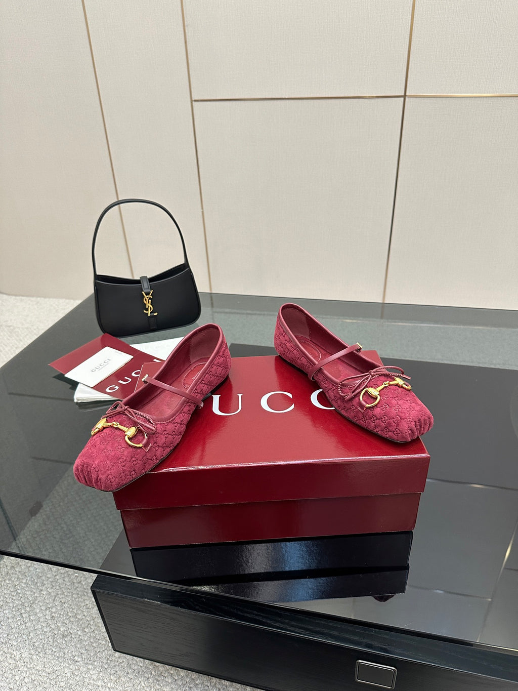 Gucci ladies pink textured loafers with gold-tone bit detail, angled view on box.