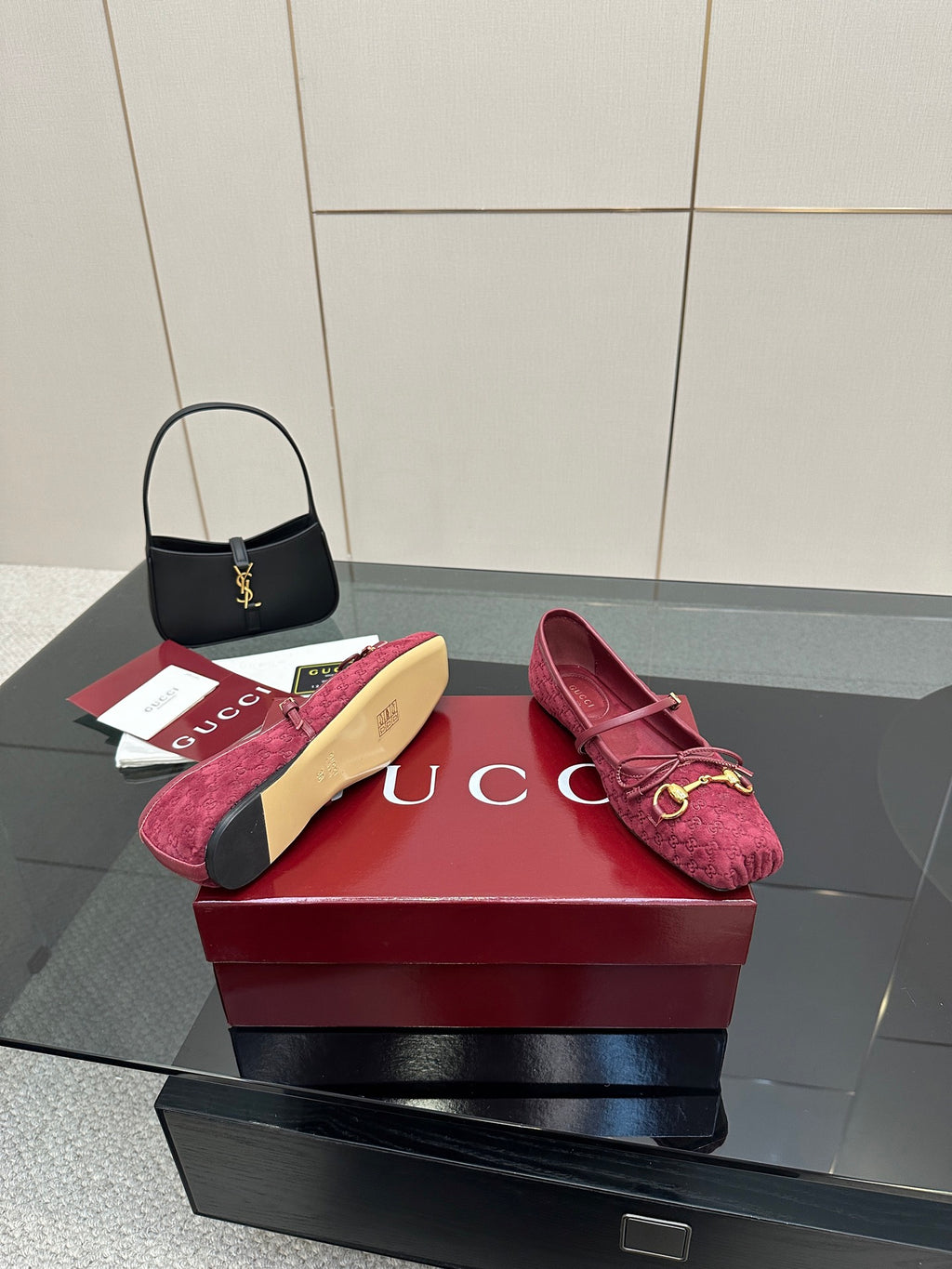 Gucci ladies pink textured loafers with gold-tone bit detail, pair on display.