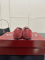 Gucci ladies pink textured loafers, heel view with gold-tone bit hardware.