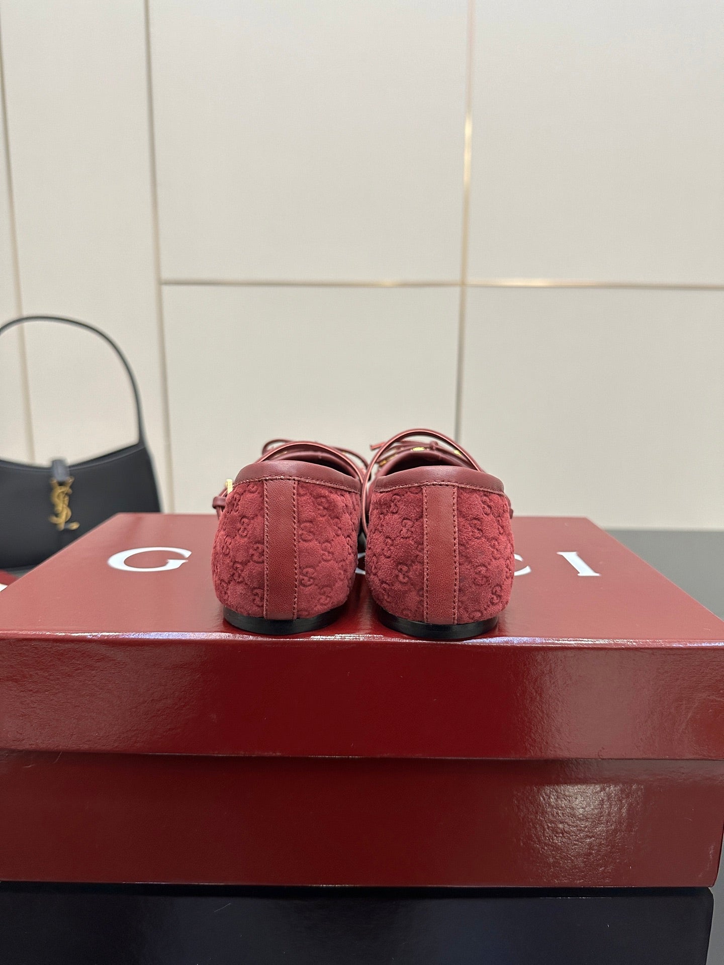 Gucci ladies pink textured loafers, heel view with gold-tone bit hardware.