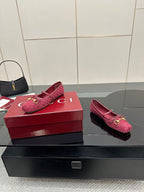 Gucci ladies pink textured loafers with gold-tone hardware, side-by-side on boxes.