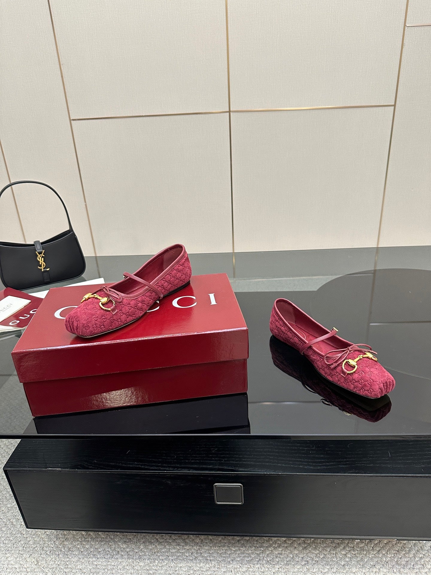 Gucci ladies pink textured loafers with gold-tone hardware, side-by-side on boxes.