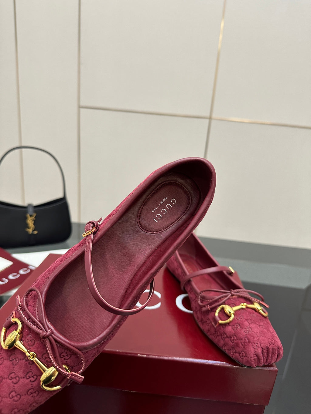 Gucci ladies pink textured loafer with gold-tone hardware, shown in profile.