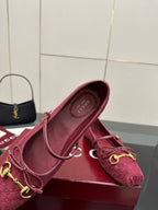 Gucci ladies pink textured loafer with gold-tone hardware, shown in profile.