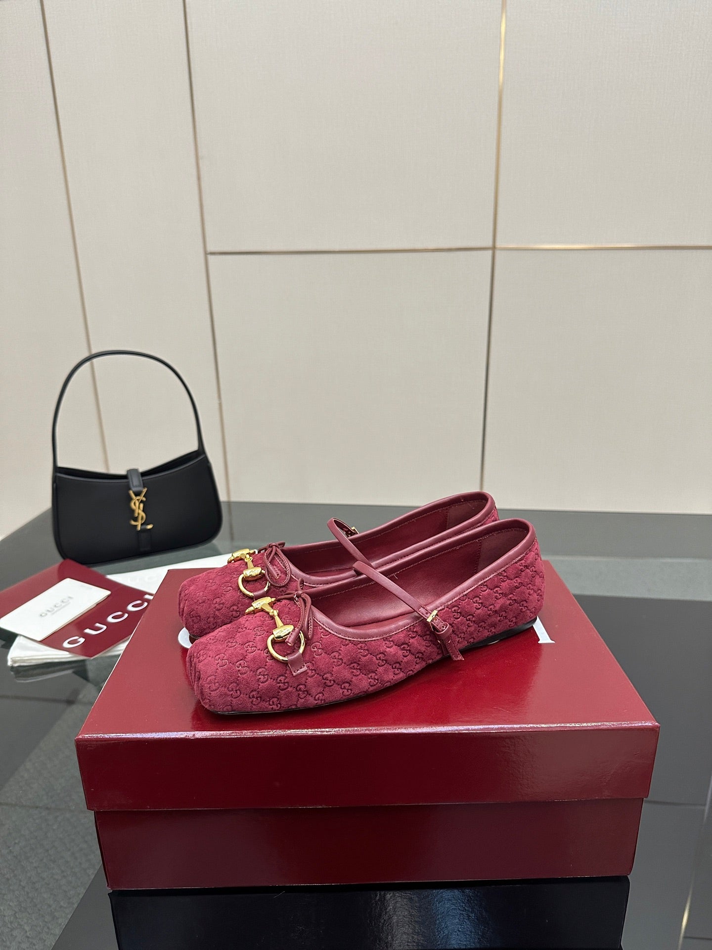 Gucci ladies pink textured loafers with gold-tone hardware, one shoe on display.