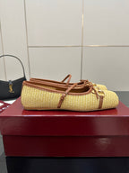 Gucci ladies woven loafers in yellow with brown trim, top view on box