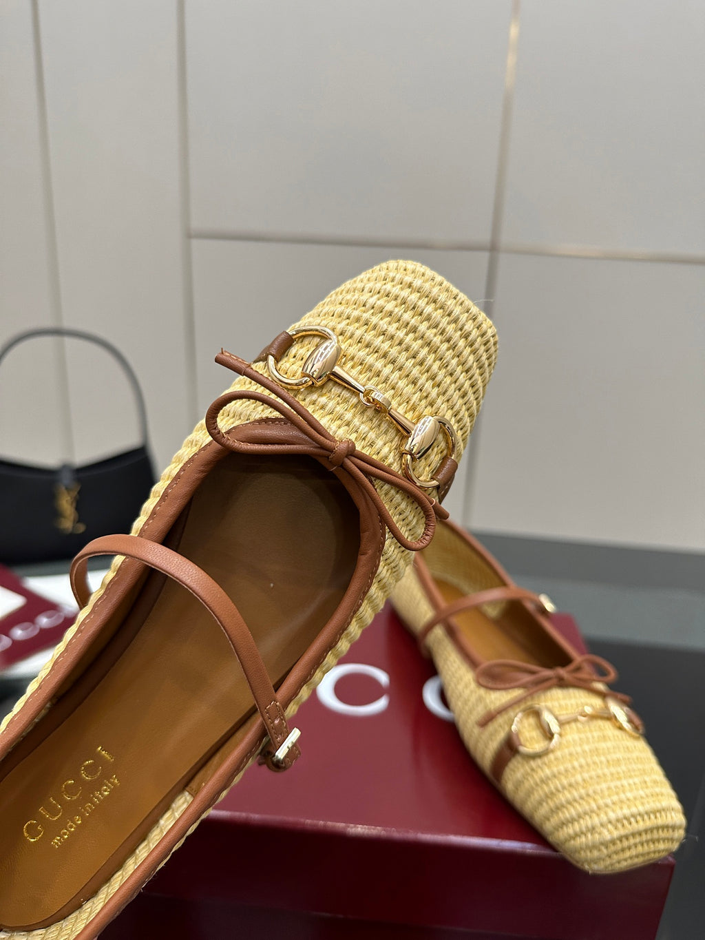 Gucci ladies woven loafer with brown leather trim, open collar and laces close-up