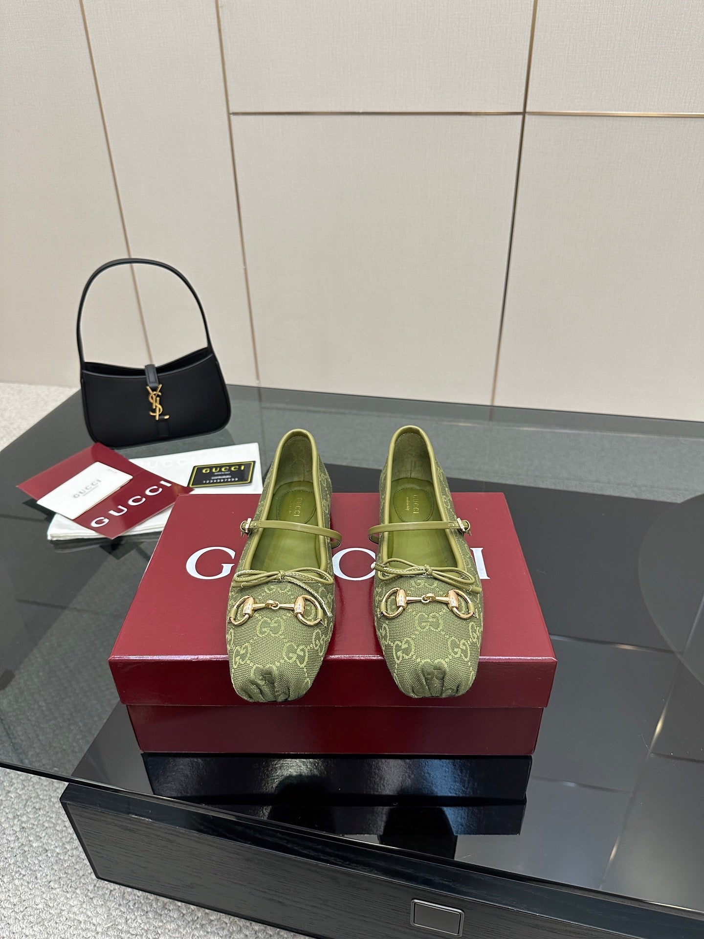 Green patterned Gucci loafer with gold-toned horsebit detail and slip-on style