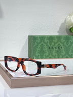 Gucci glasses with tortoiseshell rectangular frames and clear lenses