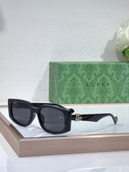 Gucci glasses with black square frames and dark lenses