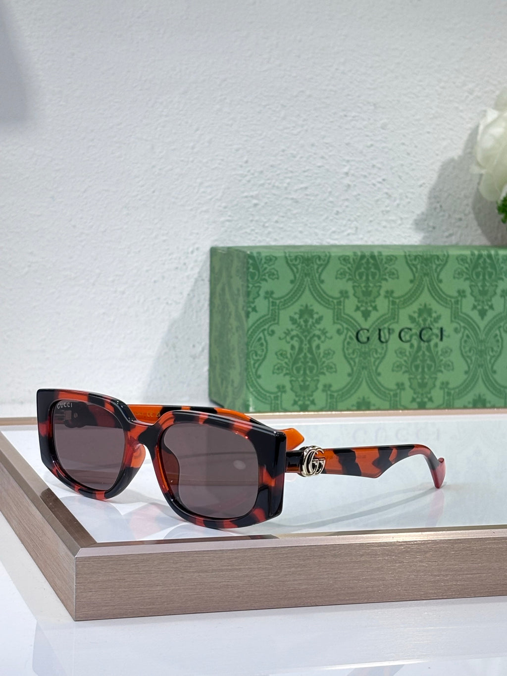 Gucci glasses with tortoiseshell frames and dark lenses