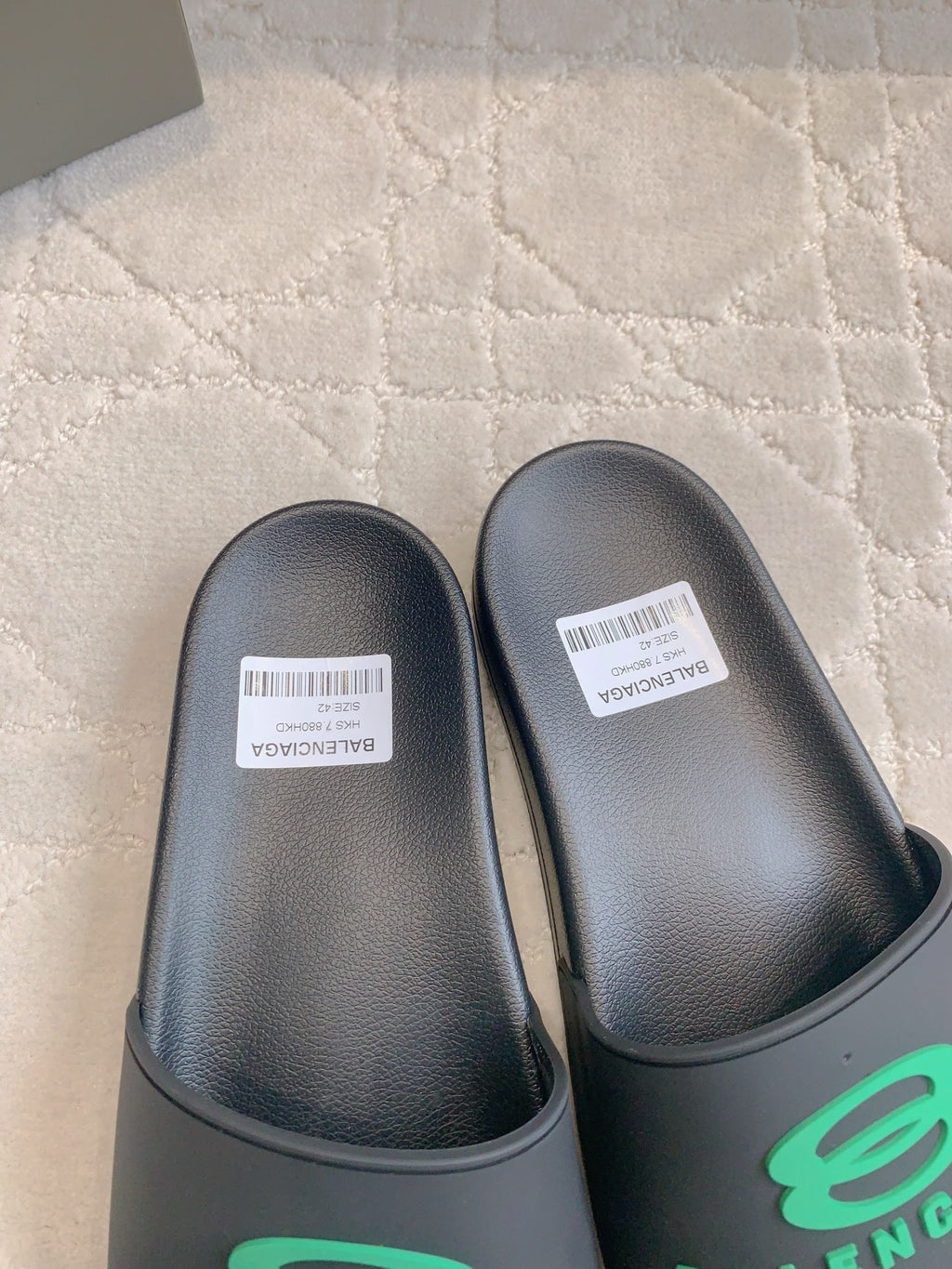 Black Balenciaga slide sandals, cushioned footbeds top view