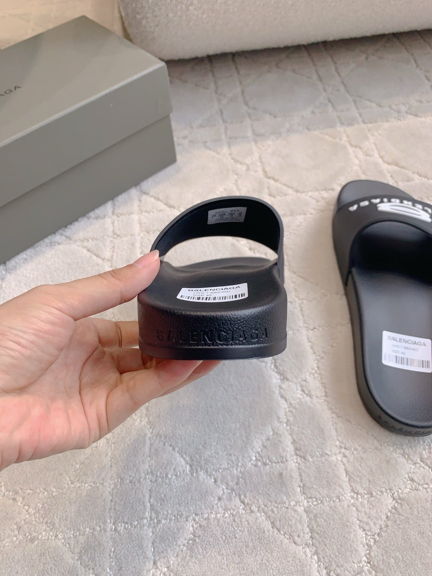 Balenciaga slide sandals, back view showing heel logo on footbed