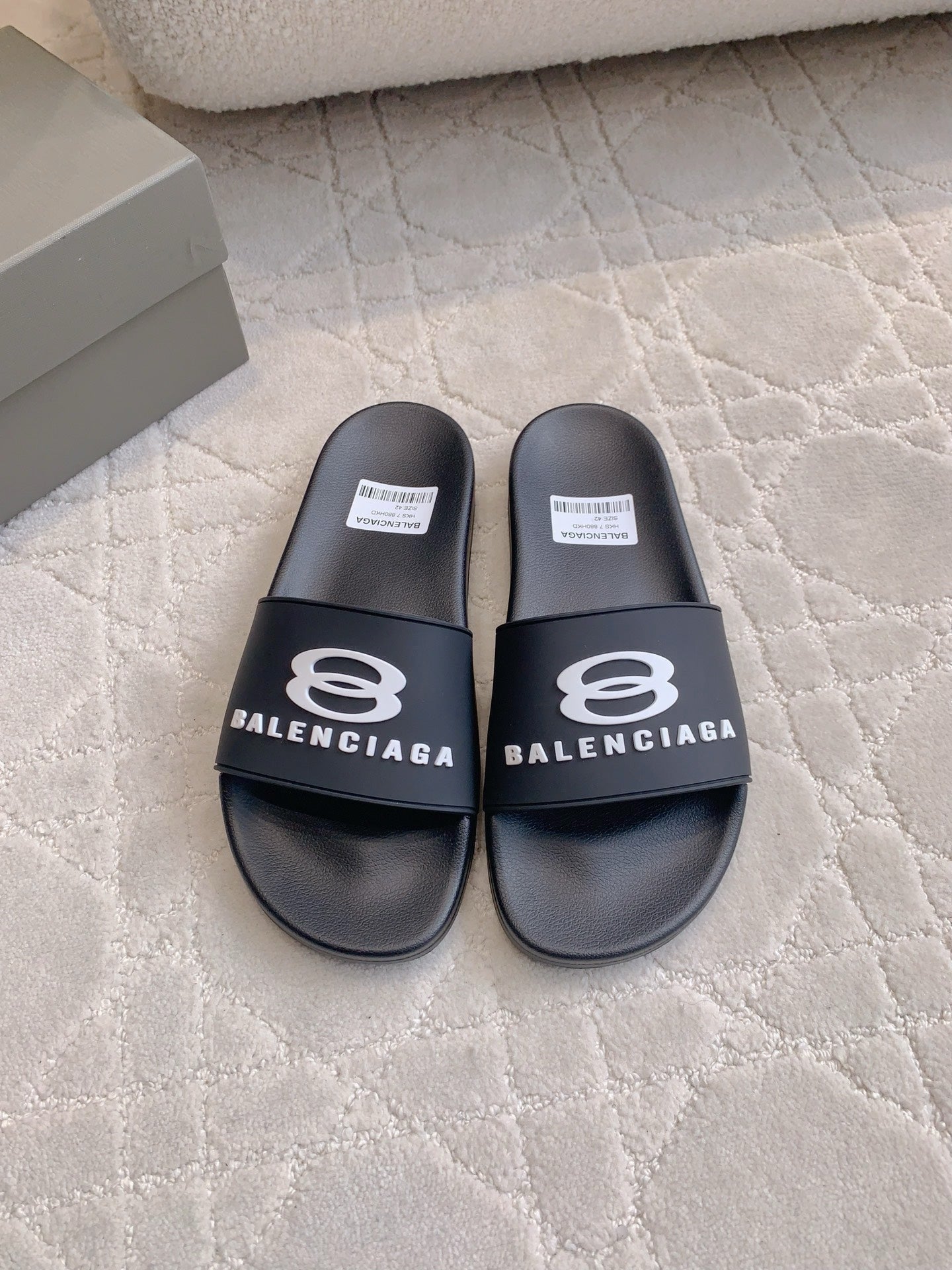 Balenciaga slide sandals with black logo strap and wide footbed