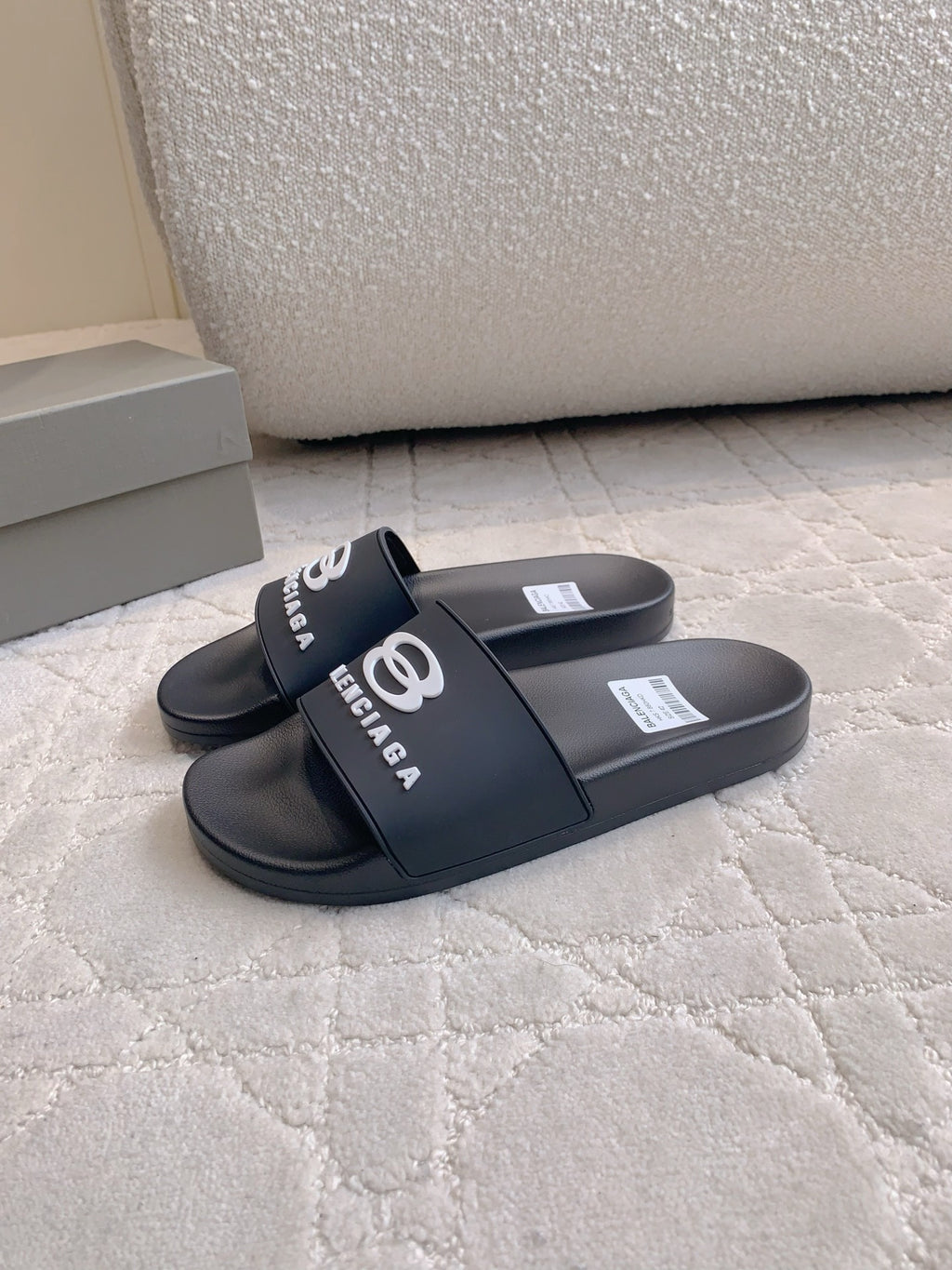 Balenciaga slide sandals, black, side view with BALENCIAGA logo strap