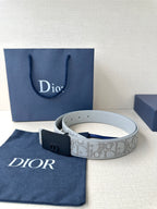 Dior belt coiled with light gray pattern strap and navy square buckle