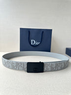 Dior belt with light gray patterned strap and dark navy rectangular buckle