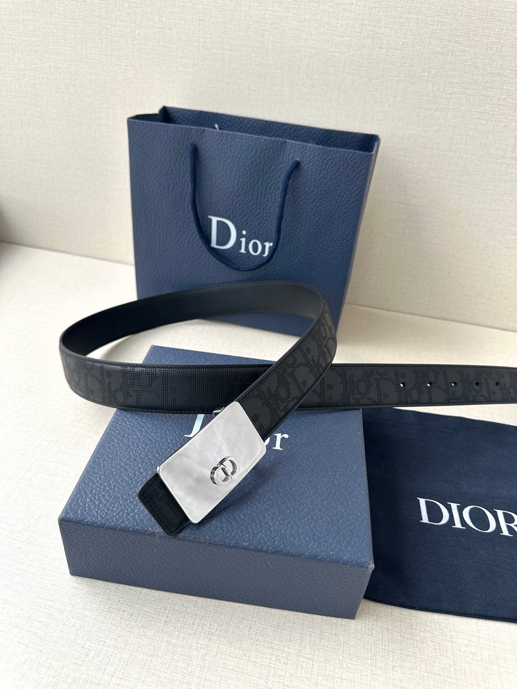 Dior belt with dark navy strap, silver-tone clasp buckle, and gift box