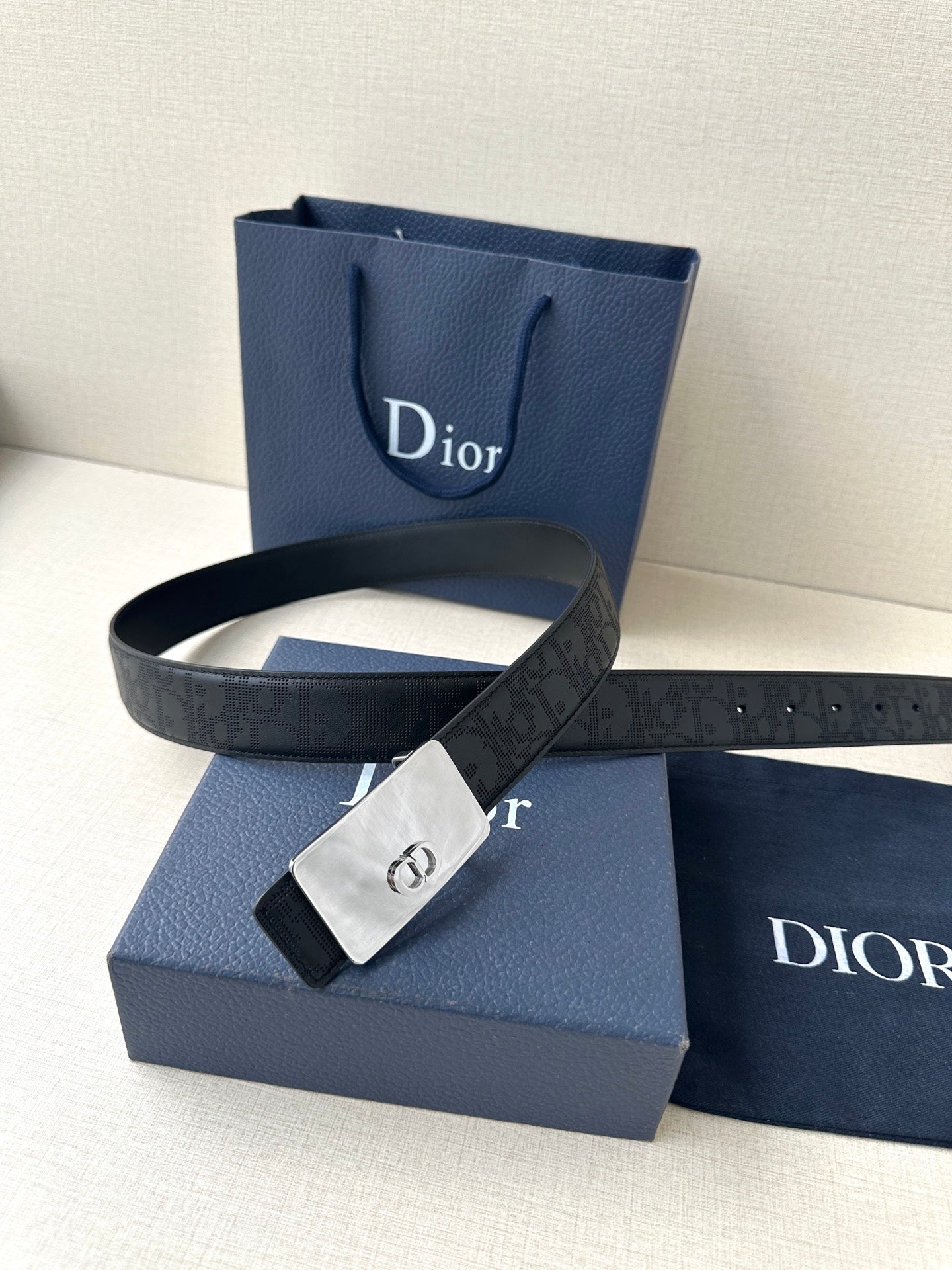 Dior belt with dark navy strap, silver-tone clasp buckle, and gift box