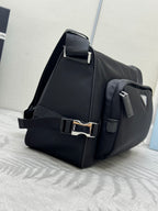 Prada dark messenger bag with adjustable shoulder strap and front flap