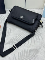 Prada dark flap messenger bag with silver-tone buckle and long strap
